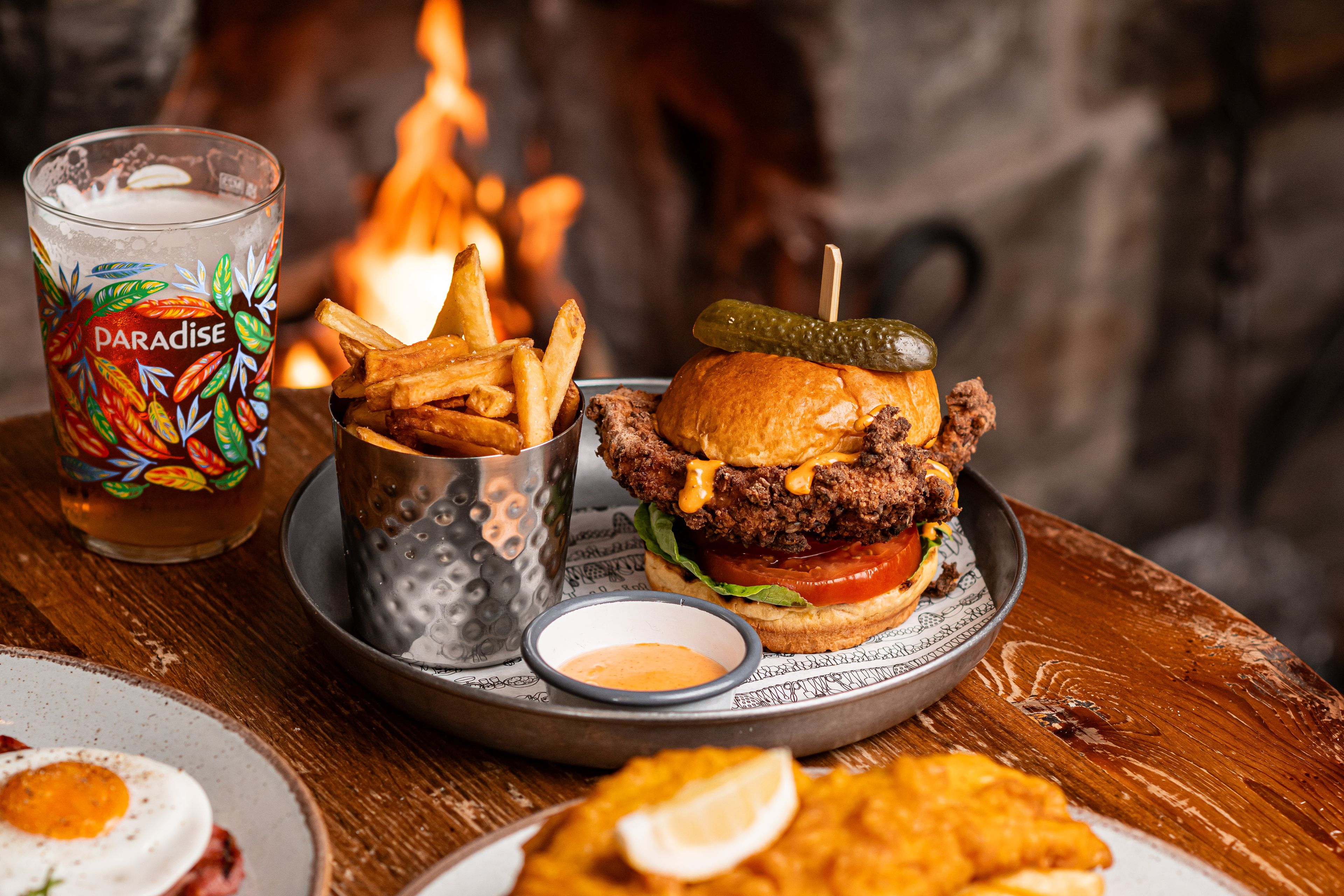 chicken burger and chips with a pint of thwaites ale